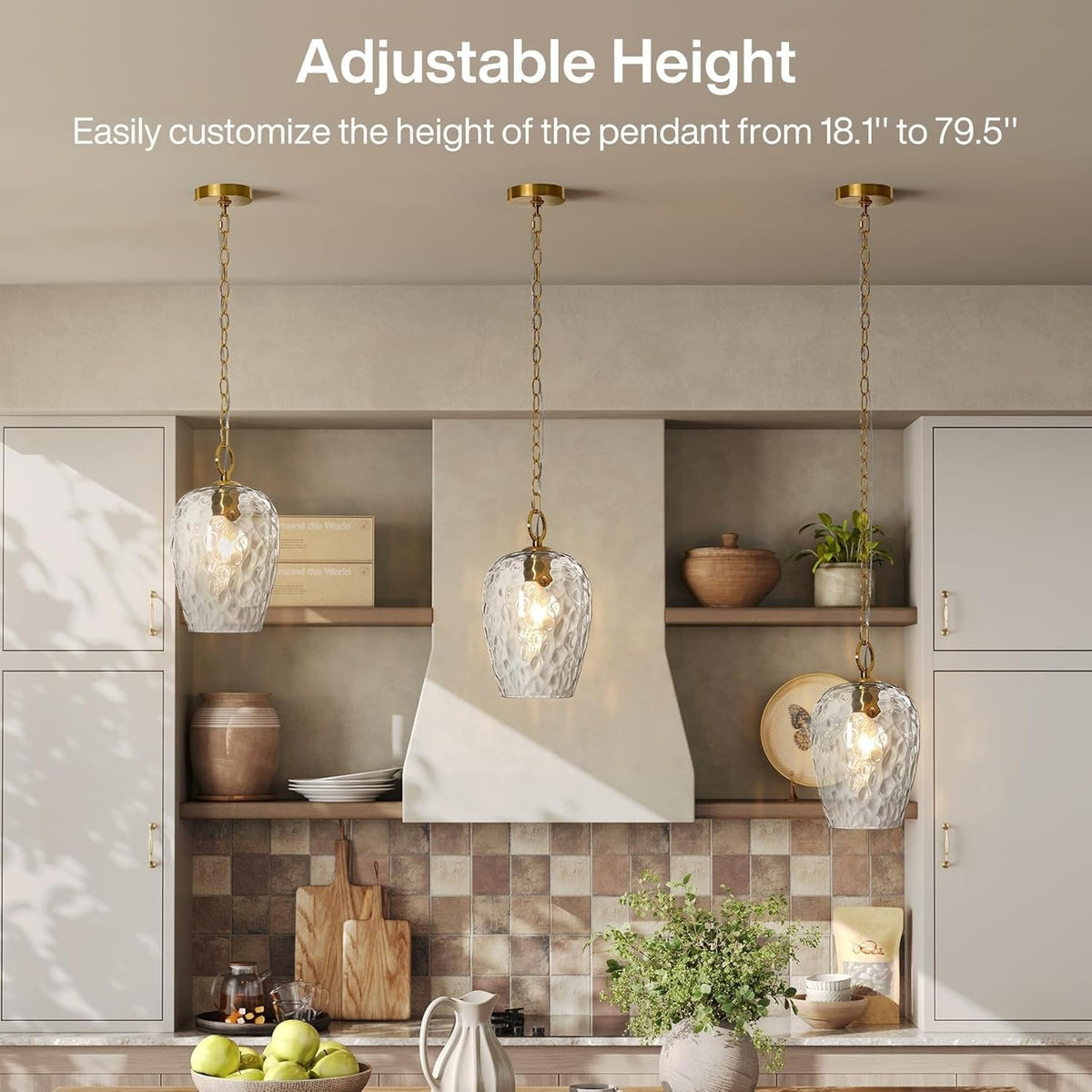 Three gold hammered glass pendant lights with adjustable chains in a kitchen setting