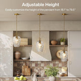 Three gold hammered glass pendant lights with adjustable chains in a kitchen setting