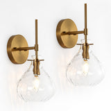 Two gold wall sconces with hammered glass shades, shown from front angle