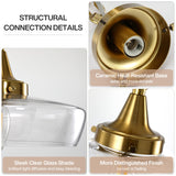 Close-up of gold pendant light's ceramic base and clear glass shade