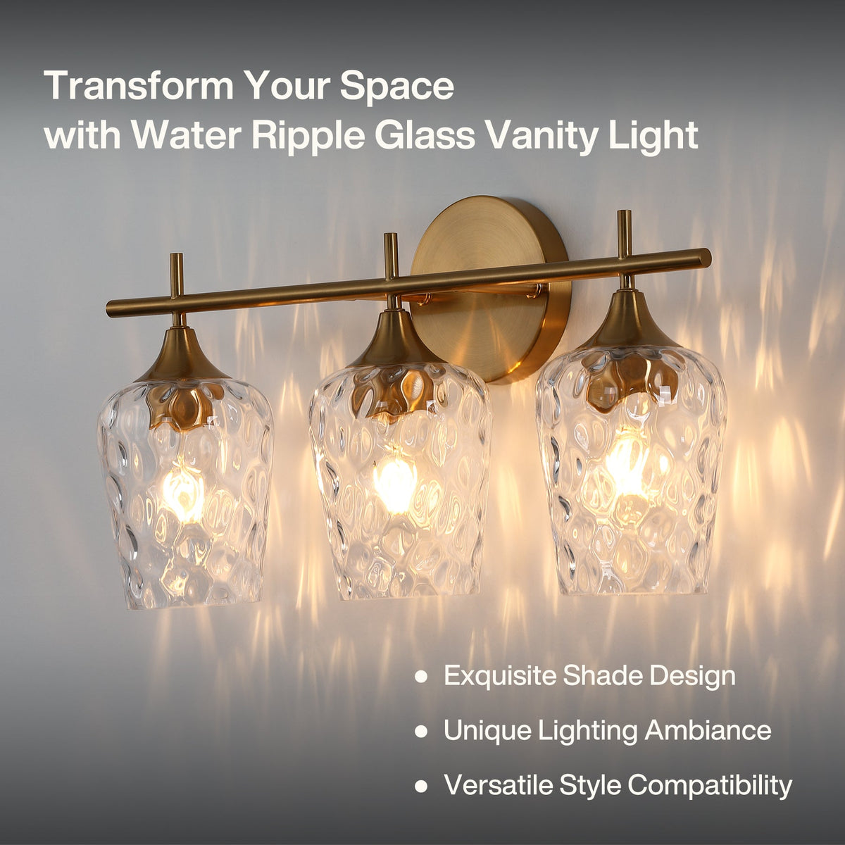 Three-light vanity light with brushed brass finish and water ripple glass shades, mounted on wall