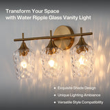 Three-light vanity light with brushed brass finish and water ripple glass shades, mounted on wall