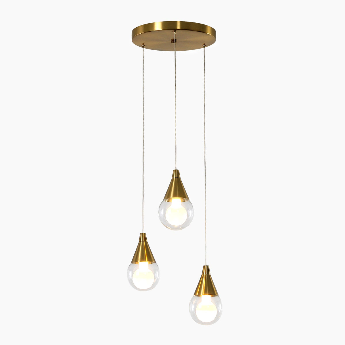 Brushed brass three-light pendant with clear glass shades, shown from above