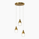 Brushed brass three-light pendant with clear glass shades, shown from above