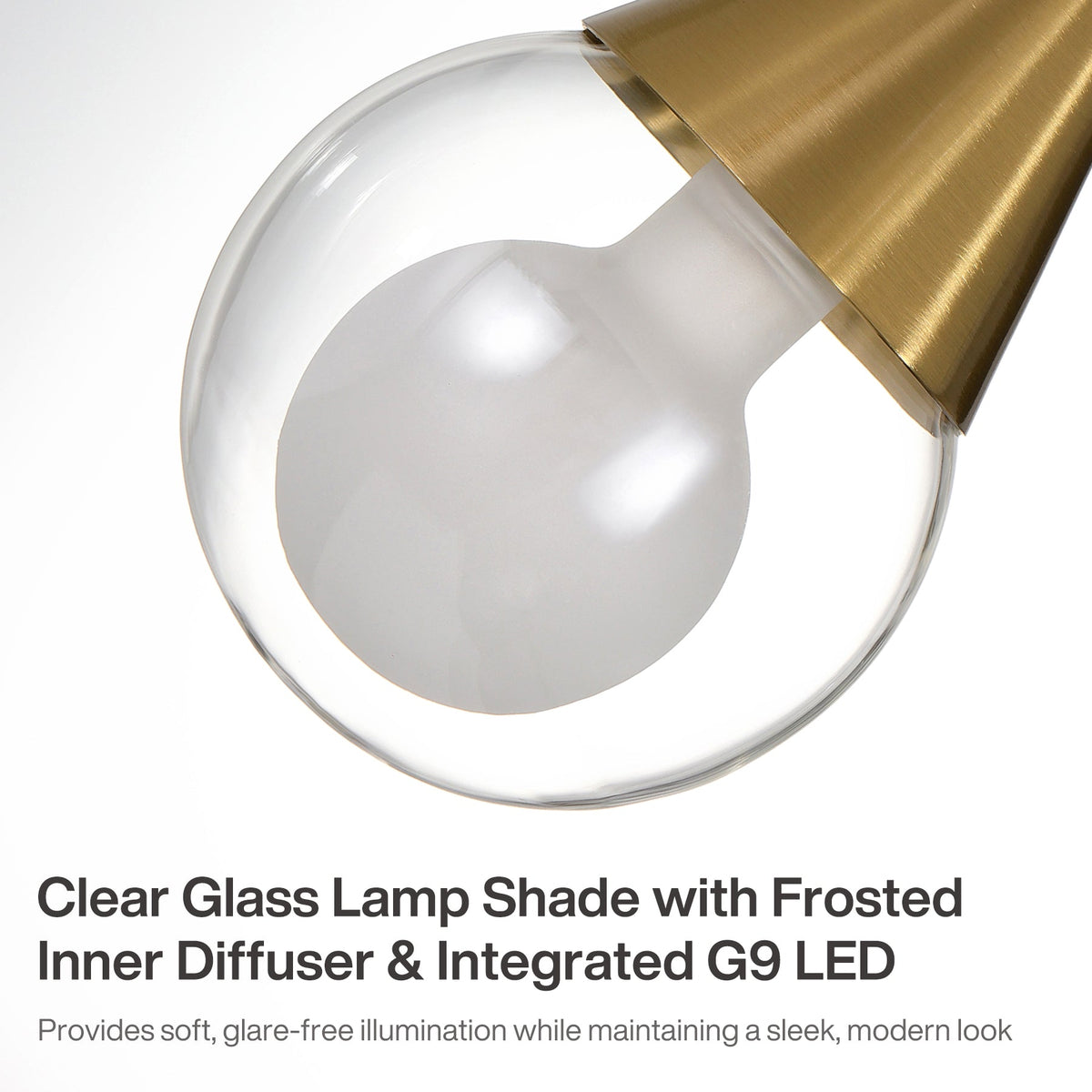 Close-up of brushed brass pendant light with clear glass shade and frosted inner diffuser