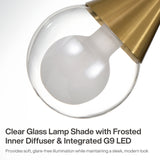 Close-up of brushed brass pendant light with clear glass shade and frosted inner diffuser