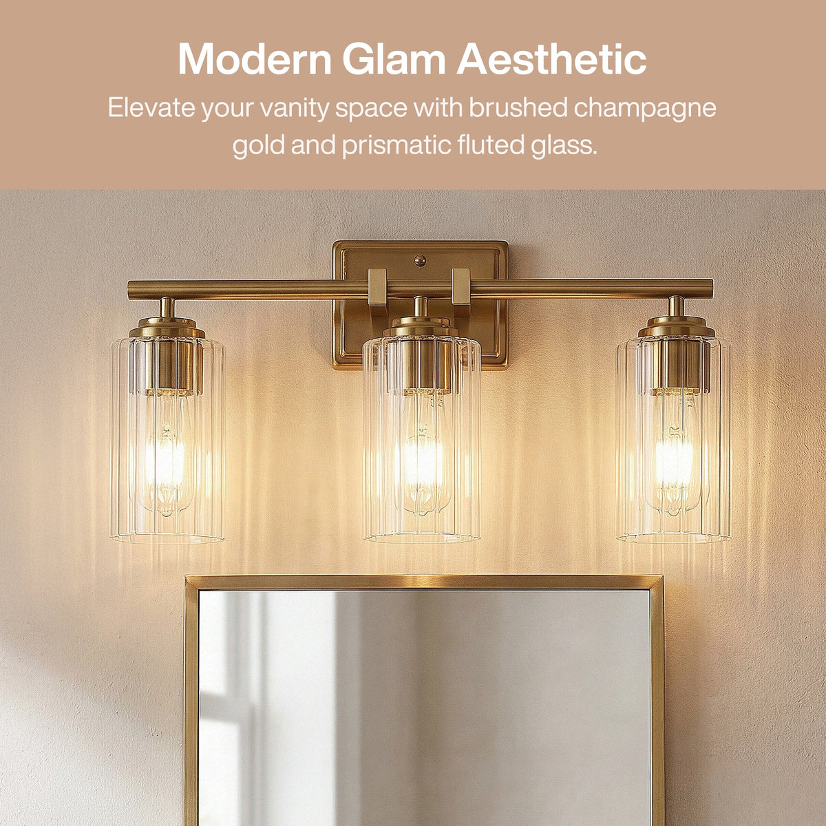 Brushed gold bathroom vanity light with three ribbed glass shades above a mirror
