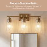 Brushed gold bathroom vanity light with three ribbed glass shades above a mirror