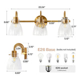 Brushed brass three-light vanity light with clear glass shades, 22.24" wide, E26 base