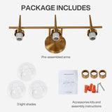 Brushed brass three-light vanity fixture with clear globe shades and included accessories