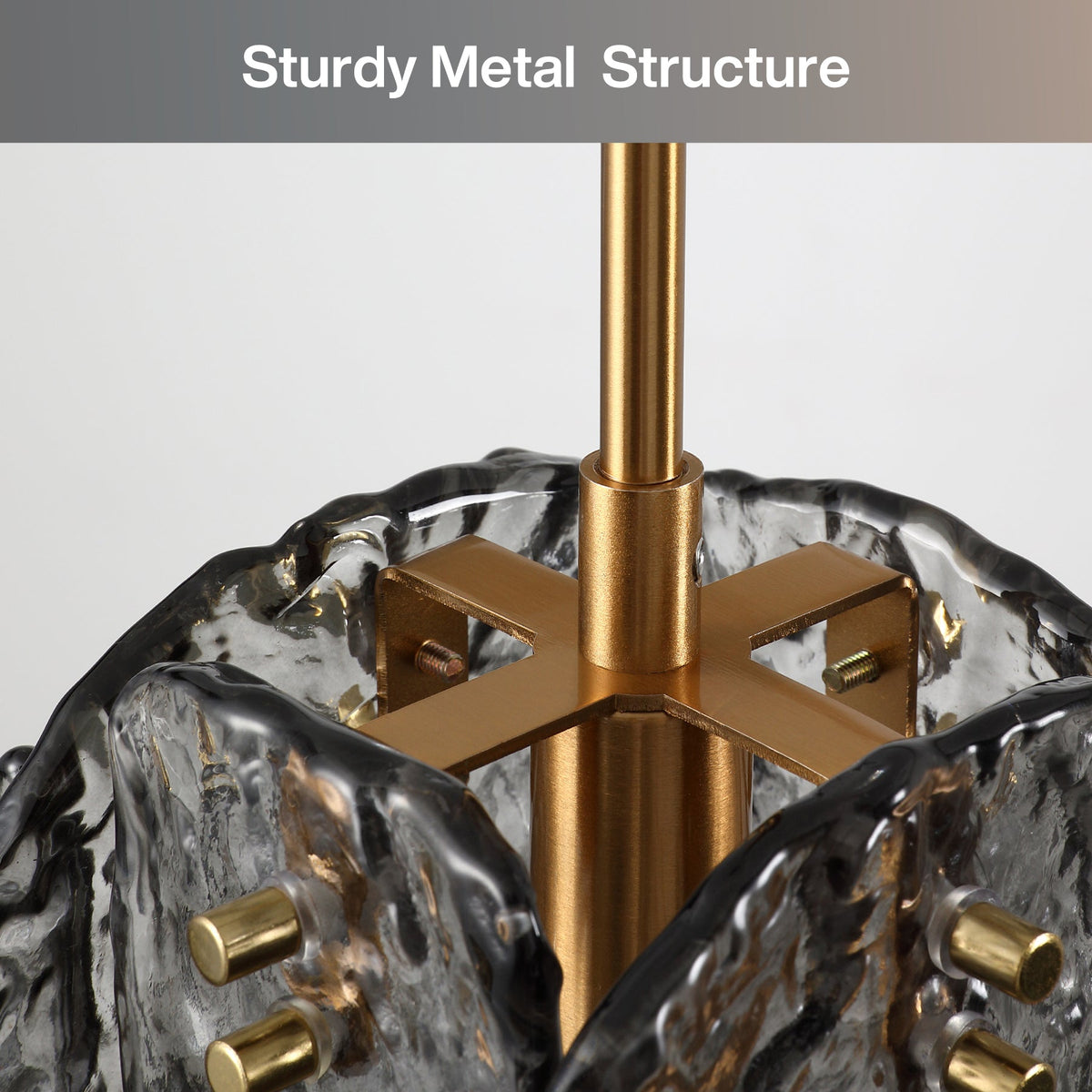 Close-up of black smoky glass pendant light with gold metal structure and adjustable height rod