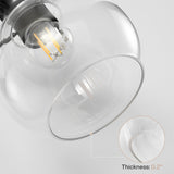 Matte black vanity light with clear glass shades, 0.2" thick, shown at an angled close-up