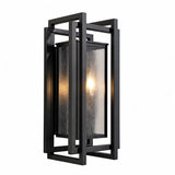 Black metal outdoor wall sconce with seeded glass panels, shown at an angle