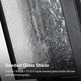 Black outdoor wall sconce with seeded glass shade, L12.05 x W4.88 x T0.12 in