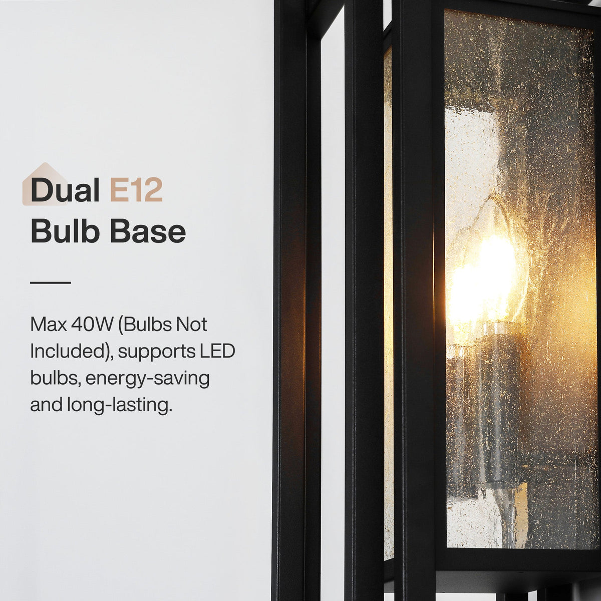 Black outdoor wall sconce with seeded glass, dual E12 bulb base, lit from within