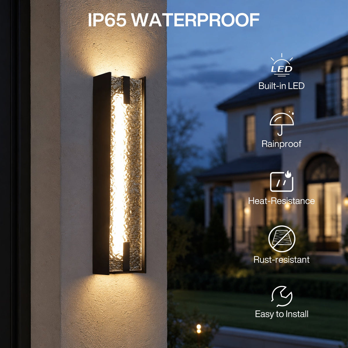 Black LED outdoor wall sconce with water ripple acrylic, shown mounted on wall at dusk