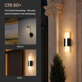Black LED outdoor wall light with acrylic panels mounted on stone wall beside door