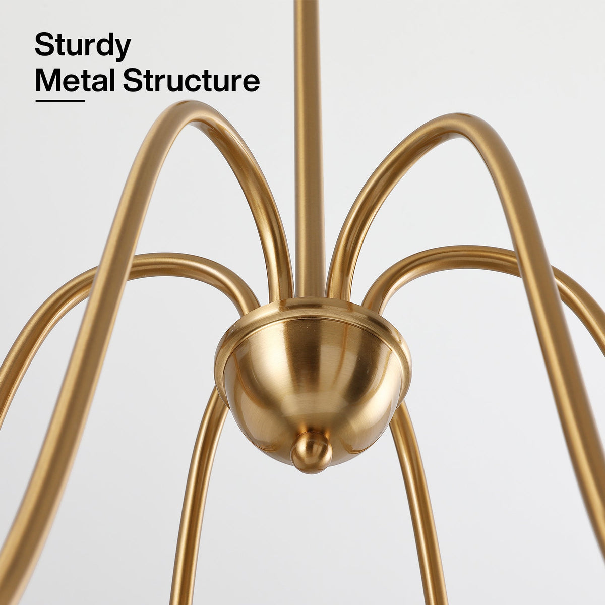 Close-up of gold metal chandelier with six curved arms and central dome