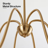 Close-up of gold metal chandelier with six curved arms and central dome