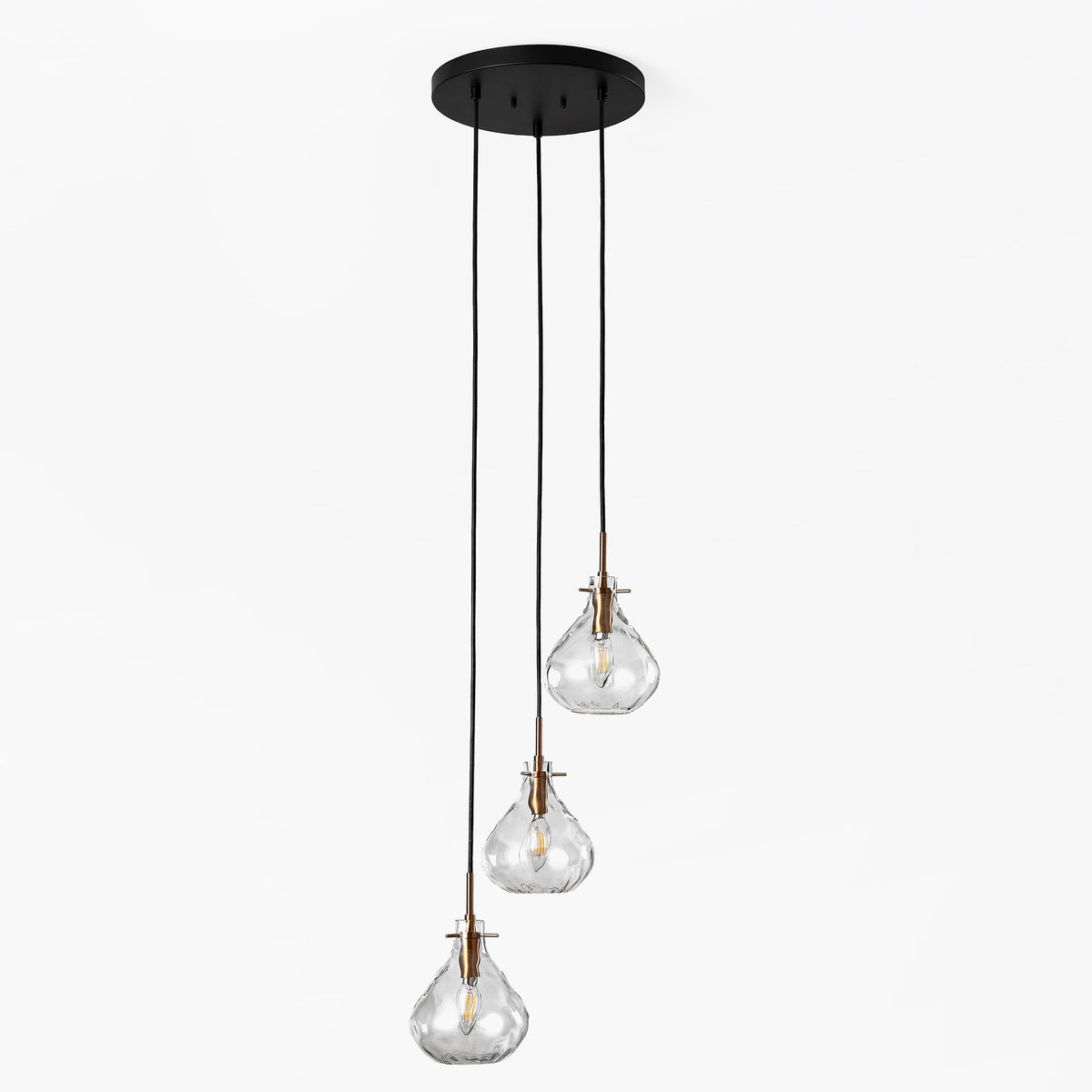Black and gold three-light pendant with water ripple glass, shown from front at angle