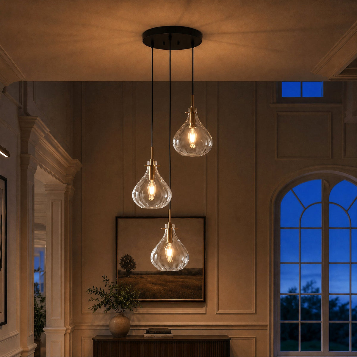 Black and gold three-light pendant with water ripple glass, hanging in a warmly lit hallway
