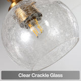 Close-up of clear crackle glass shade with gold fixture and LED bulb