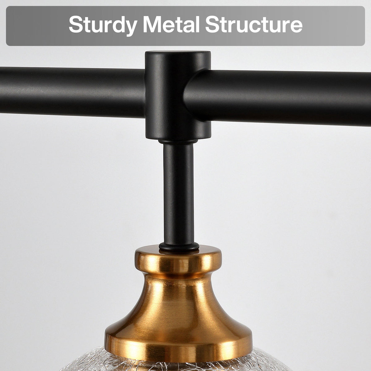 Close-up of black metal chandelier arm attached to gold base with crackle glass shade