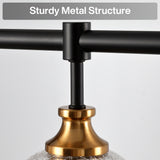 Close-up of black metal chandelier arm attached to gold base with crackle glass shade