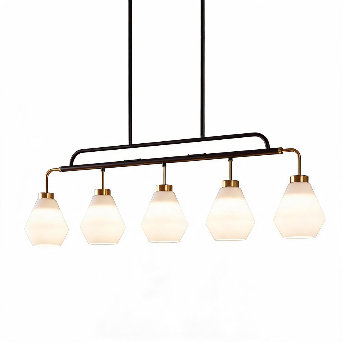 Five-light kitchen island pendant with frosted white glass shades, black and brass frame, shown from front