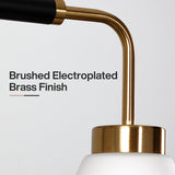 Close-up of a five-light kitchen island light with frosted white glass, black and brushed electroplated brass finish