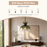 Brass pendant light with gradient green glass dome shade, shown hanging over a dining table