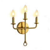 Three-light gold wall sconce with brass candle-style bulbs, shown from front angle