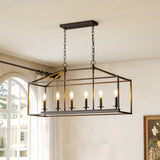 Black metal six-light farmhouse chandelier with candle-style bulbs, hanging in a room with arched window