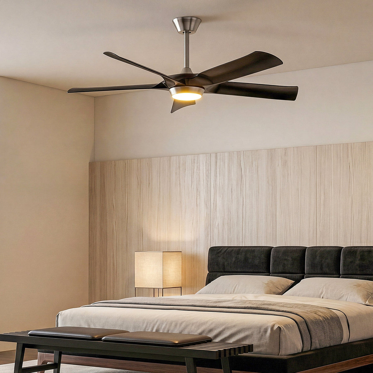 Black five-blade ceiling fan with integrated light, shown in a bedroom setting