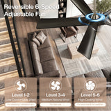 Black ceiling fan with five blades, shown from above in a modern living room with sofa and stairs