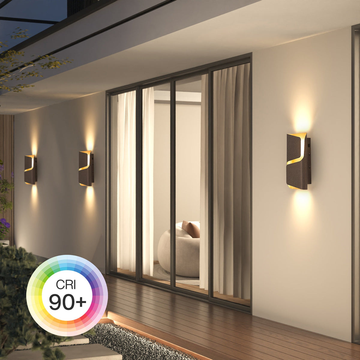 Three modern LED wall lights in dark brown with gold accents mounted on a wall beside glass doors, emitting warm light