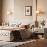 Gold crystal leaf wall sconce with fabric shade mounted on bedroom wall