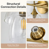Gold bathroom vanity light with clear glass shades and ceramic base, close-up structural details