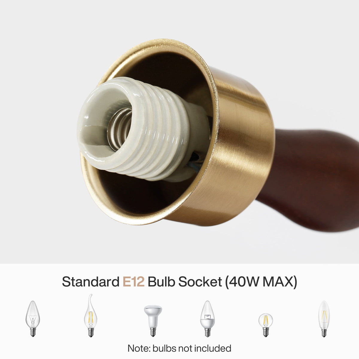 Close-up of vintage wall sconce's E12 bulb socket with brass finish and wooden arm