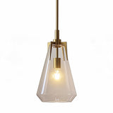 Gold pendant light with clear glass shade, shown from front angle