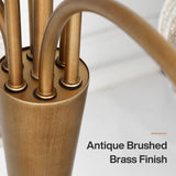 Close-up of antique brushed brass chandelier base with six curved arms