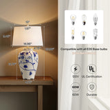 Blue and white porcelain table lamp with burlap shade, 13.78" tall, shown on wooden nightstand