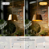 Gold drum pendant light with industrial metal shade, shown off and on in a room with brick wall and plants